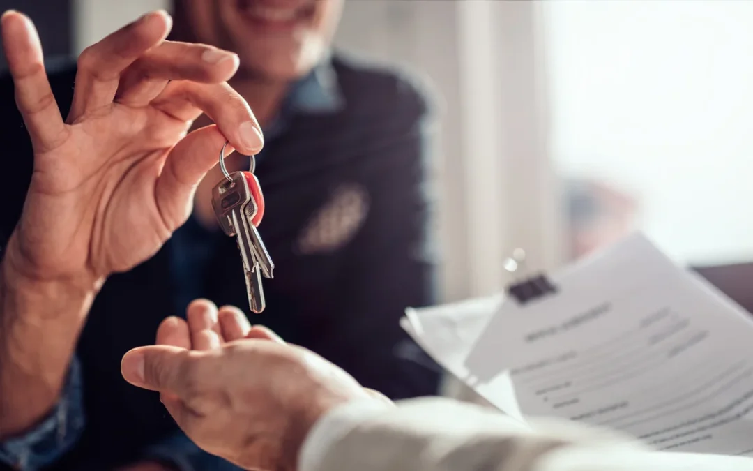 A landlord reviewing tenant applications and background checks to find reliable renters.