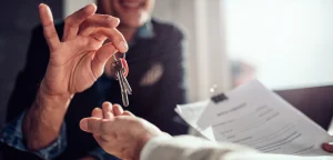 A landlord reviewing tenant applications and background checks to find reliable renters.