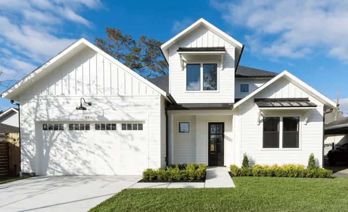 Home renovation crew updating cabinetry and paint inside a Houston brick bungalow to boost property value